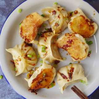 Vegan dumplings with spicy dipping sauce