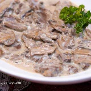Lengua in White Mushroom Sauce