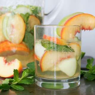 White sangria with whiskey, apple and peach