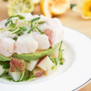 Ceviche with potato and pea shoot salad