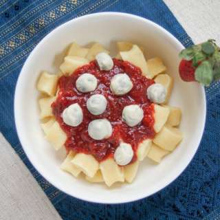 Dessert gnocchi with balsamic strawberry sauce