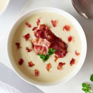 German Creamy Horseradish Soup with Bacon Flakes and Cress