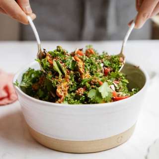 Warm Kale Quinoa Salad with Tahini-Harissa Dressing