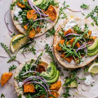 Roasted Sweet Potato Pitas with Arugula and Garlic Dressing
