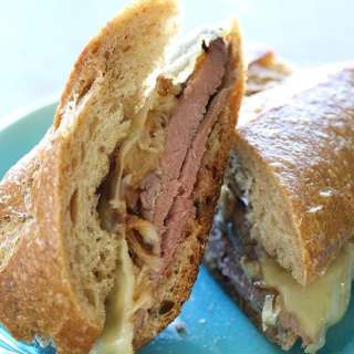 Roast Beef Sandwich with Melted Cheese and Caramelized Onions