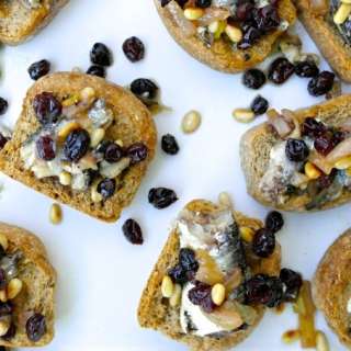 Greek Style Bruschetta with Sardines, Raisins and Pine Nuts