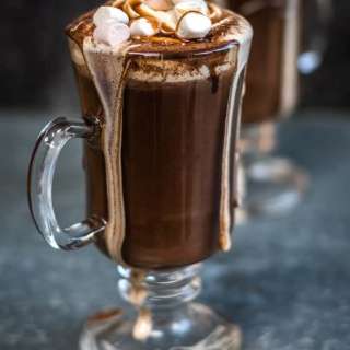 Red wine hot chocolate with marshmallows and whipped cream topping