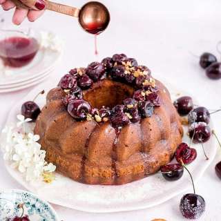 Amaretti ricotta semolina bundt cake with cherry compote
