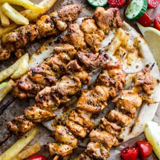 Broiled chicken thighs in skewers