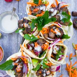Spicy Harissa lamb shoulder chunks in pita cones with Tahini sauce
