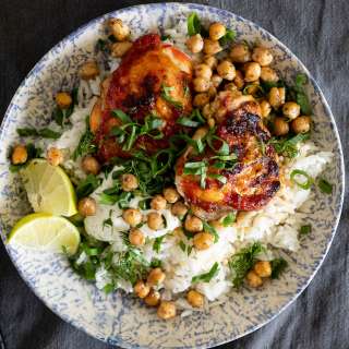 Harissa chicken thighs with crispy chickpeas and rice