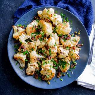 Sweet and Spicy Roast Cauliflower with garlic, sultanas and capers