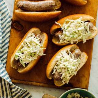 Creamy Whole Grain Mustard Slaw Topped Bratwursts
