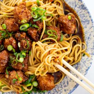 Crispy pork with saucy spicy noodles