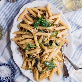 Zucchini and mushroom carbonara with fresh basil