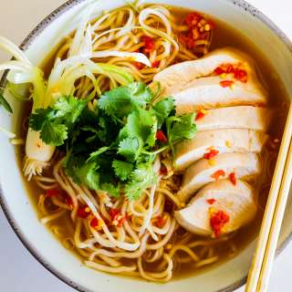 Spicy Miso soup with poached chicken and noodles