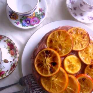 Vegan chocolate orange cake with chocolate buttercream frosting and candied orange slices