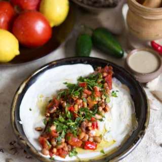 Black eyed pea masabacha with tahini, tomatoes, garlic and hot peppers