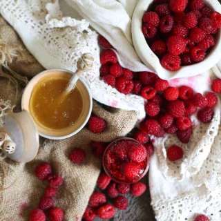 Clean raspberry preserves with honey
