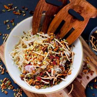Russian Korean-style kohlrabi salad with apples, radishes and spicy salad topper