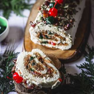 Gluten Free Yule Log with Medjool Dates, Mascarpone Cream, Maraschino Cherries and Pistachios