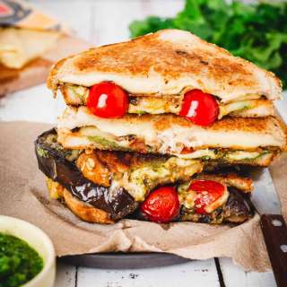 Eggplant grilled cheese with cherry tomatoes, zaatar, tahini and Yemenite hot sauce