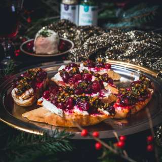 Cranberry goat cheese bruschetta with garlic herb chermoula