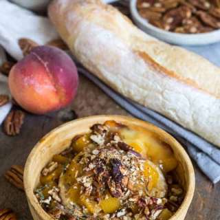 Baked brie with peaches, pecans, herbs and honey