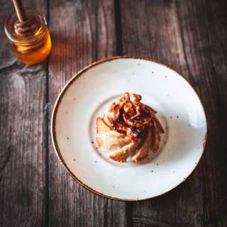 Gluten Free Honey Cake topped with honey-glazed walnuts