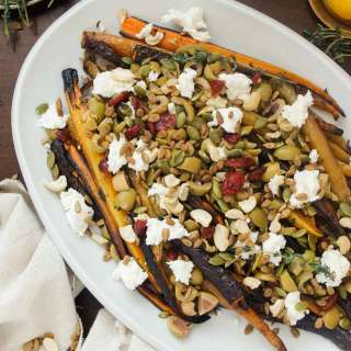 Middle Eastern roasted carrots with olives, goat cheese, salad topper and harissa-preserved lemon dressing
