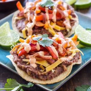 Chipotle Black Bean Tostadas with Onions and Peppers