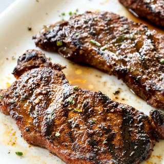 New York Strip Steaks with Harissa Butter