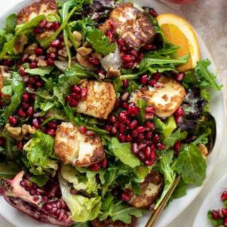 Pomegranate Greens Salad with Halloumi Croutons and Spiced Orange Vinaigrette.