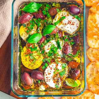 Marinated Goat Cheese with Basil and Olives.