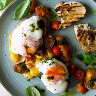 Sauteed Tomato Breakfast Crostini With Poached Eggs