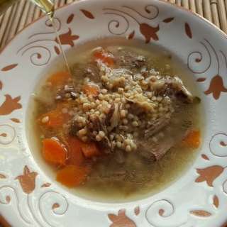Homemade beef broth with whole-wheat grattoni pasta