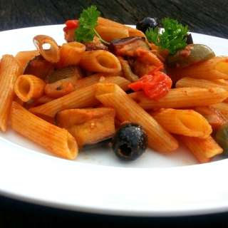 Whole wheat penne with aubergine and pine nuts