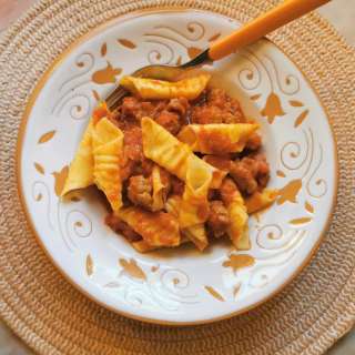 Homemade garganelli pasta with sausage ragu recipe.