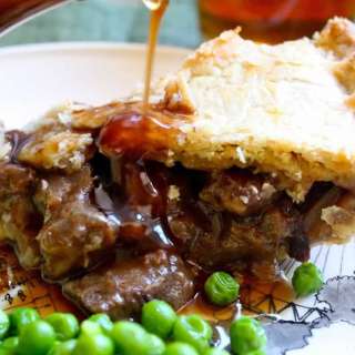 Steak Pie with Peas, Mashed Potatoes and Gravy