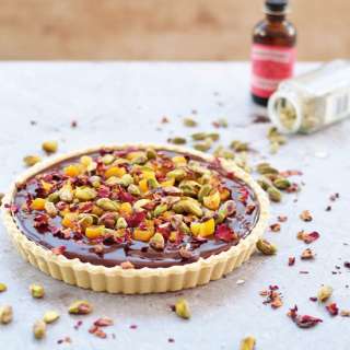 Chocolate tart with Cardamom, Apricots and Rose Petals