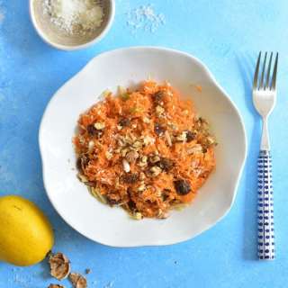 Carrot apple salad with raisins, cinnamon, walnuts and coconut