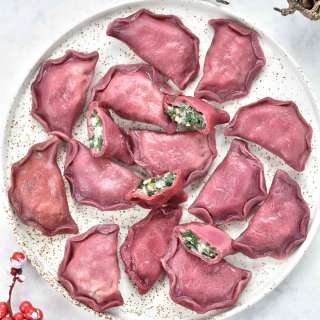 Pink Pierogi with spinach, potatoes and feta cheese filling