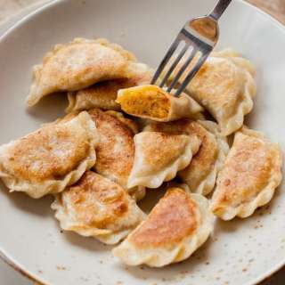 Vegan pierogi with spicy red lentil and sun-dried tomato filling