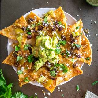 Chilaquiles With Black Beans, Avocado, and Pickled Jalapenos