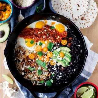 Simple Skillet Huevos Rancheros with Fried Black Beans and Cotija Cheese