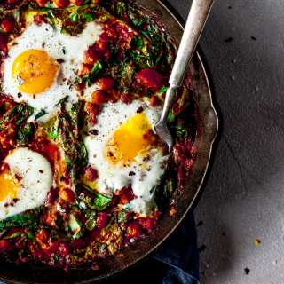 Harissa Baked Eggs Recipe with Chickpeas, Spinach, and Sumac