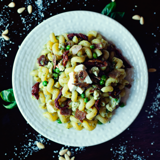 Pesto Pasta with Prosciutto, Peas, and Sun-Dried Tomatoes