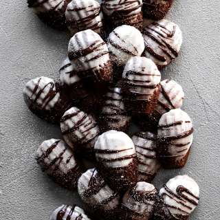 Hot Chocolate Madeleine Cookies with Marshmallow Frosting
