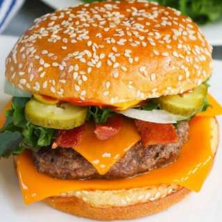 Homemade Burger with Bacon, Cheese, and Lettuce Toppings