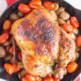 Cast Iron Skillet Roasted Garlic Butter Chicken with Potatoes and Tomatoes